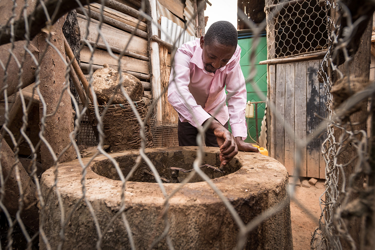 Phocas works at his farm in Rwanda