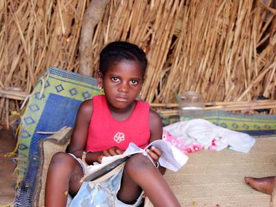  In Djenné Cercle, Mali, Hawa, a displaced child, reads from her notebook.