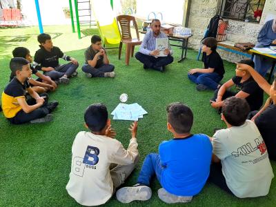 A group of adolescents during a EASE session in the central West Bank in August 2025
