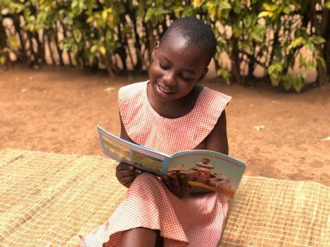 Jolly, 9, in Rwanda has become a strong and confident reader thanks to World Vision's Unlock Literacy programme
