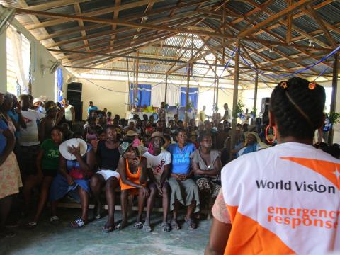World Vision staff conducting awareness session on hygiene and cholera prevention in the communities affected. 