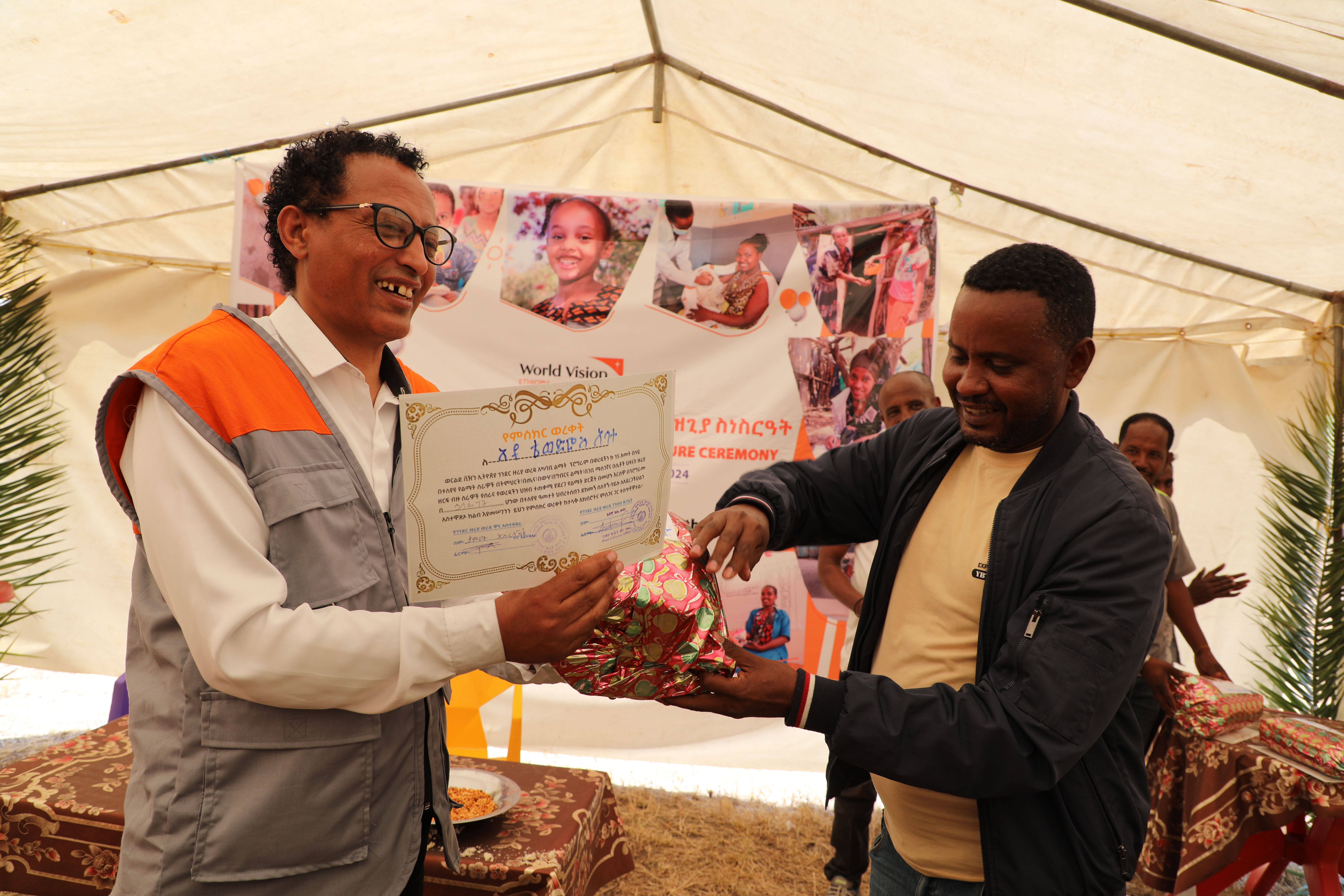 Tewodros Abate receiving an acknowledgement 