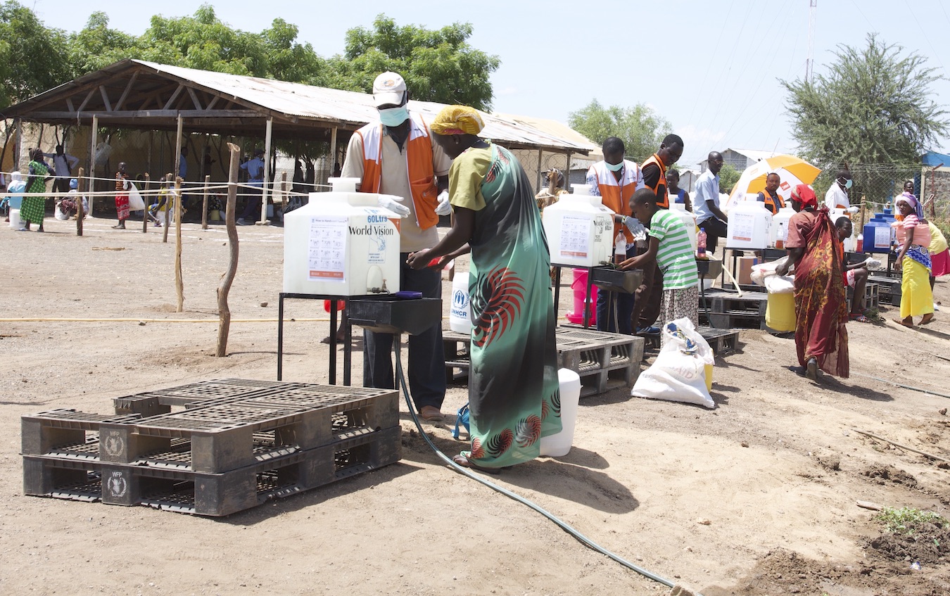 Refugees washing hands with soap and water before getting food at Kakuma Refugee Camp.  ©World Vision Photo