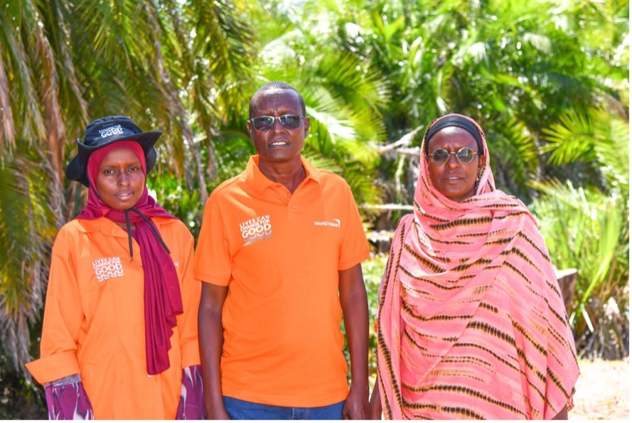 Maimuna with her parents at the World Vision Garba Tulla Area Programme closeout ceremony. © World Vision Photo/Felix Pilipili