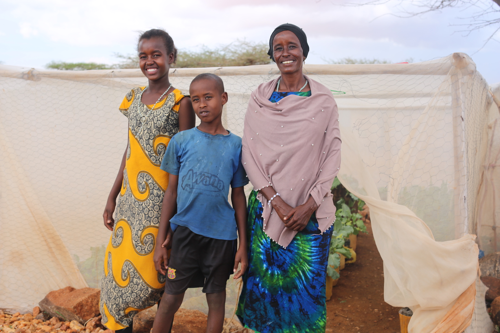 Right to Left; Saroi with her two children Lolusu (8) and Neitumu (10). © Copyright World Vision/By Irene Sinoya.