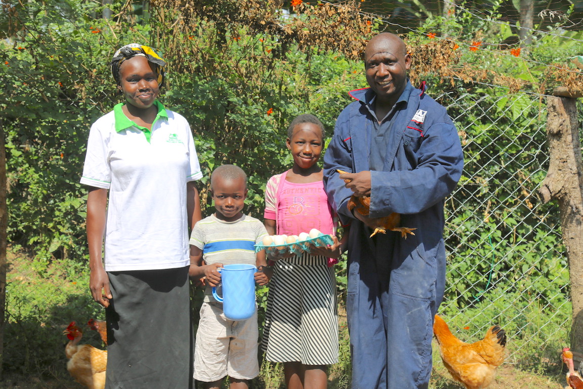 Carolyne, her husband Seth and their children Stacy (11) and Fabian (6) at their home in Angurai, Busia County, Kenya.