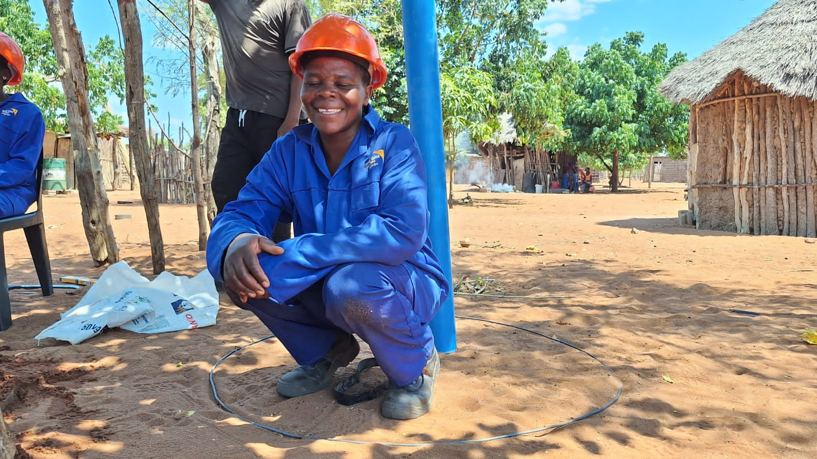 Gilda, smiling as she tested the dimensions of the latrine.