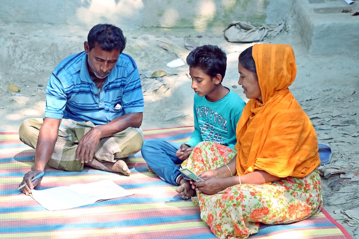 Mohammad, MenCare participant, with his wife Monjuri and their son