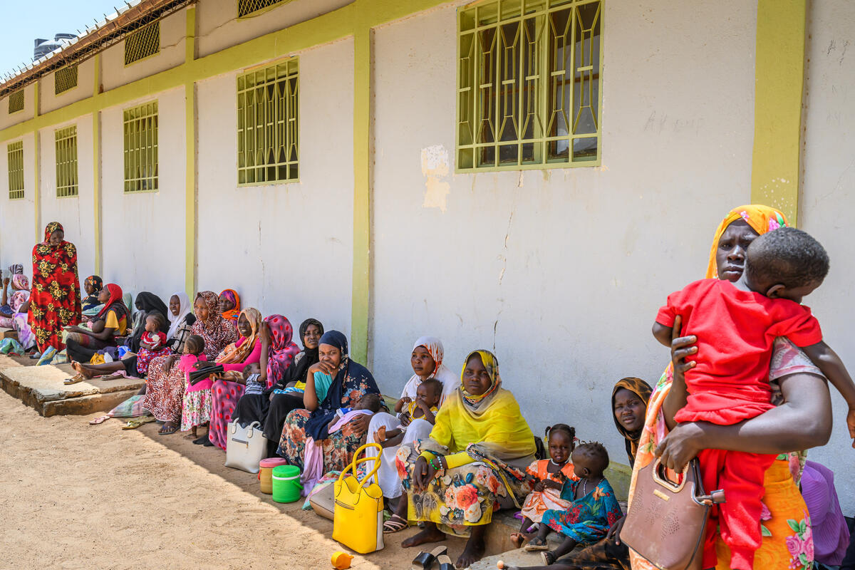 women and children outside the nutrition centre