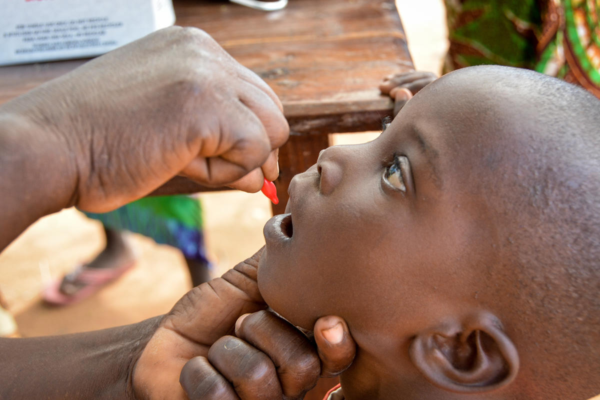 Child gets an oral vaccination