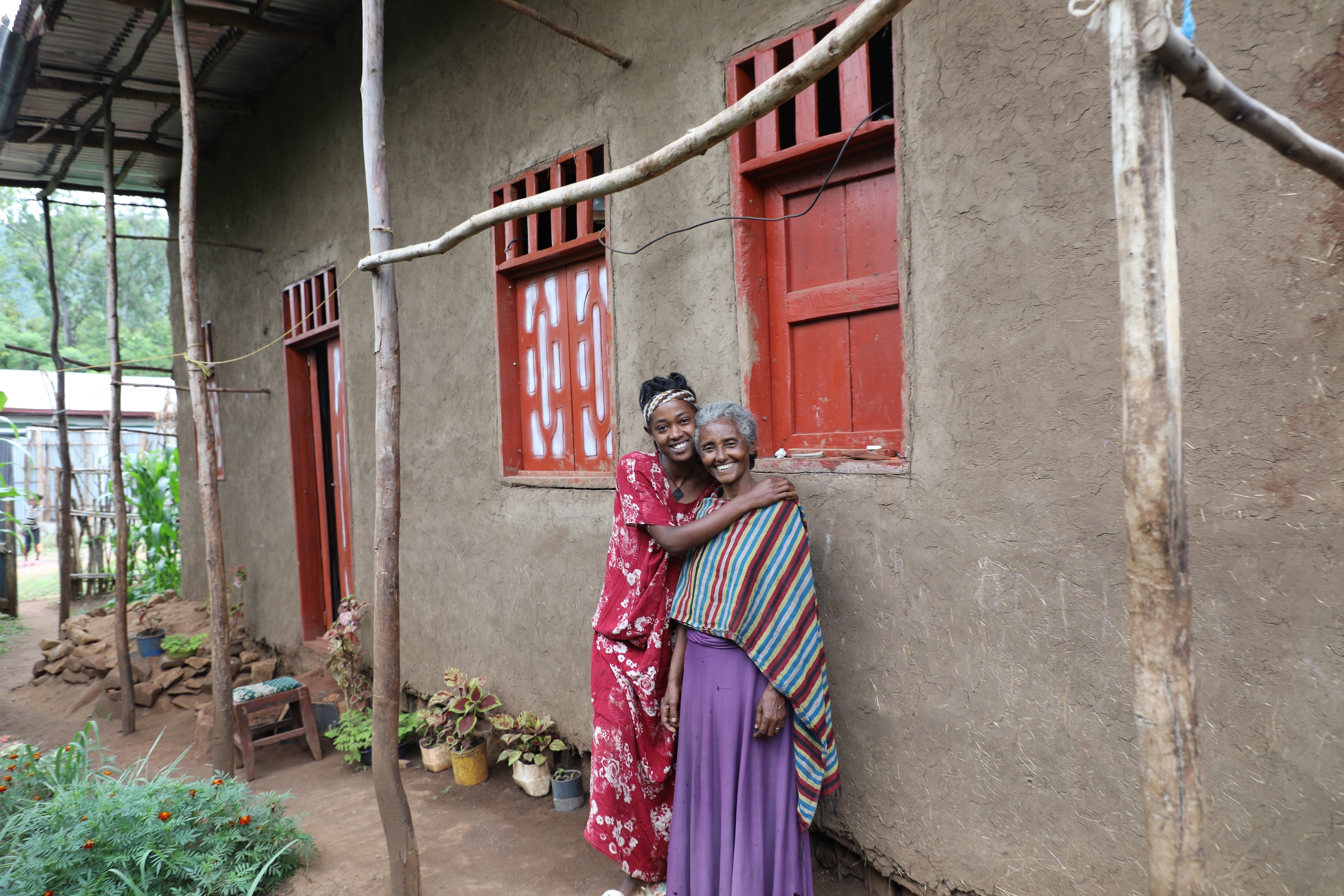 Meseret and her daughter in their new home