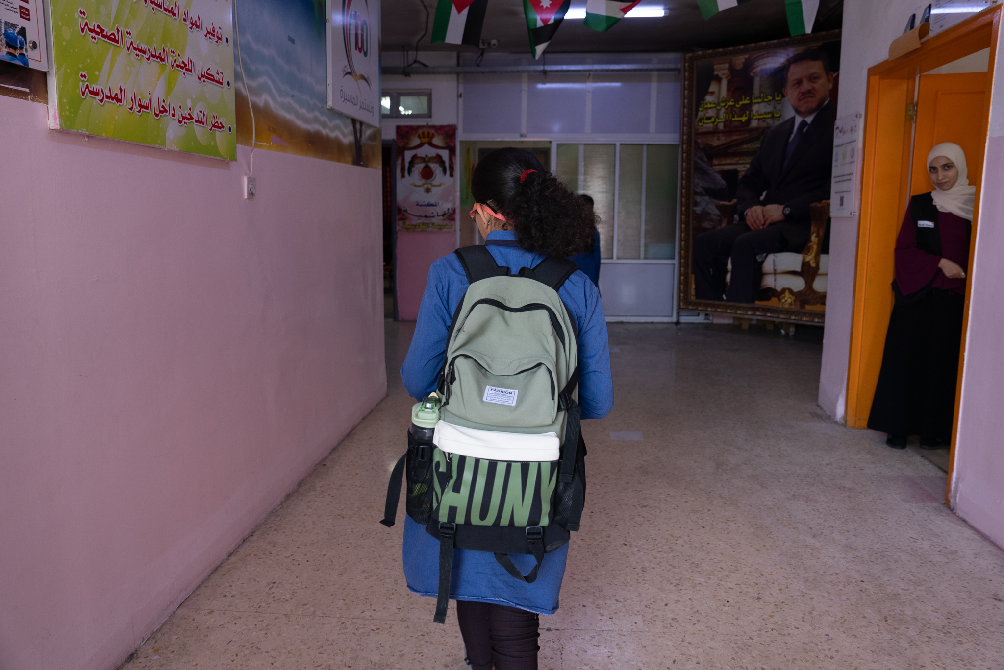 Dana* entering her school in Irbid.   World Vision Syria Response, Joanna Zreineh