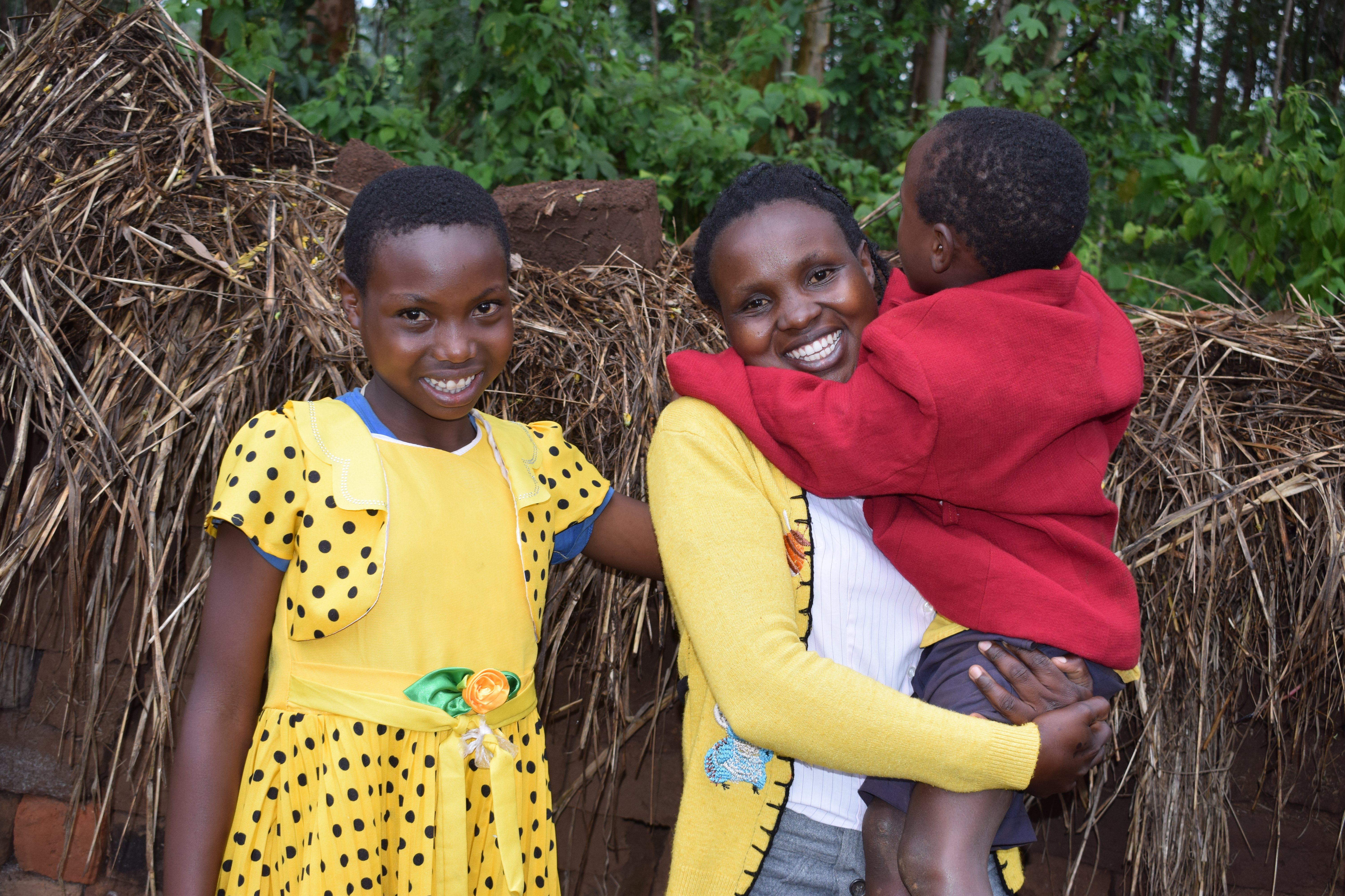 Cynthia (11), her sister Annah (26) and Annah’s baby Steven (6) at their home in Nyamusi, situated in Western Kenya.  As a result of Cynthia becoming a sponsored child, her family and community are now economically empowered through World Vision’s Savings for Transformation (S4T) model.