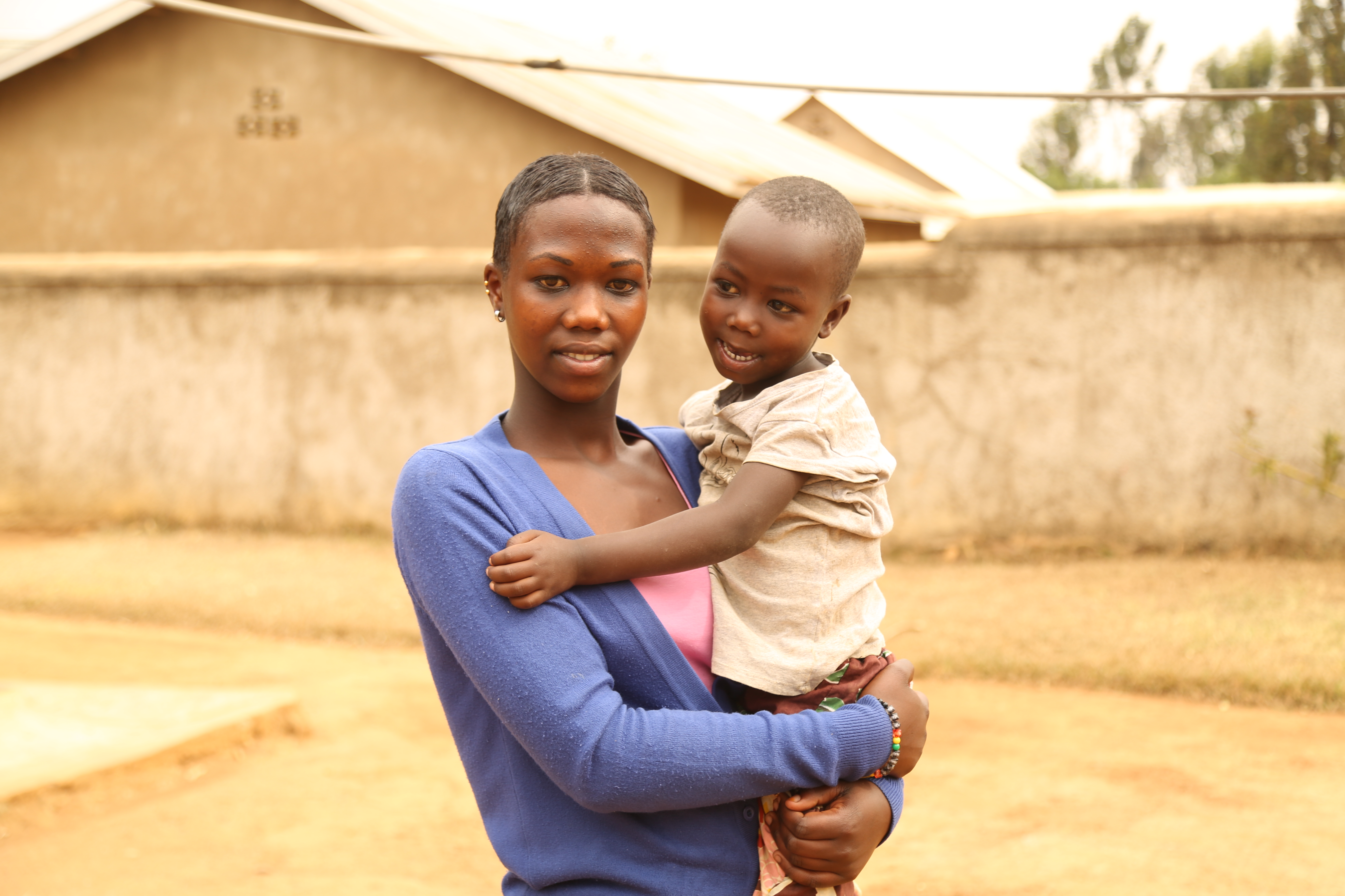 Dorcas with her 4 - year - old daughter