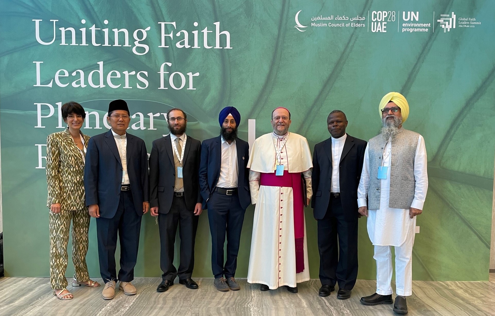 Charlotte Masiello-Riome, Senior Advisor Communications & External Engagement (left) joins Doctor Mohamed Cholil Nafis, President of the Indonesian Ulema Council (second from left), Bishop Paolo Martinelli of the Apostolic Vicariate of Southern Arabia (center) and other delegates.  