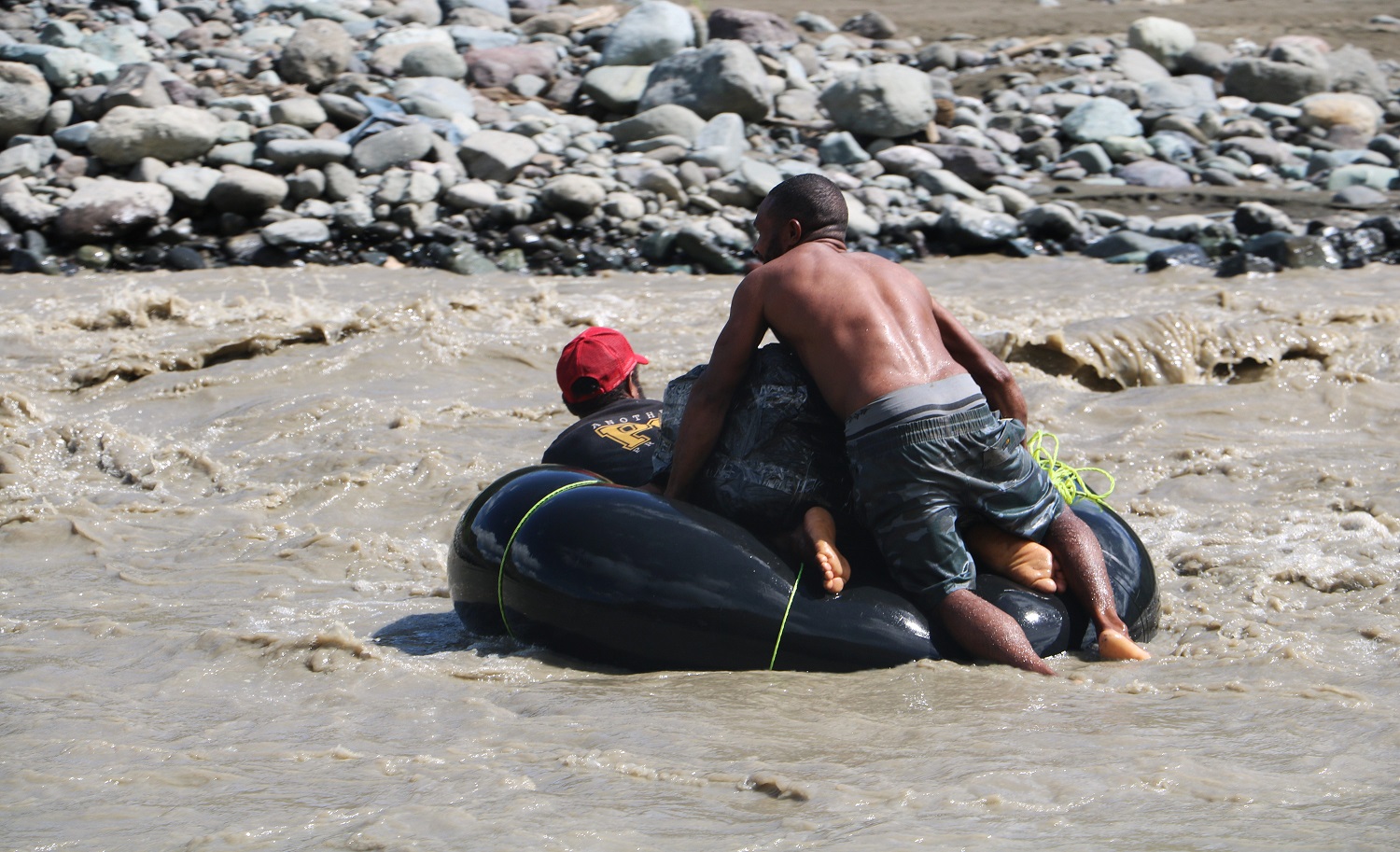 The communities mode of transport in crossing the Leron River are in tubes from Semi - Trailers such as in the image.