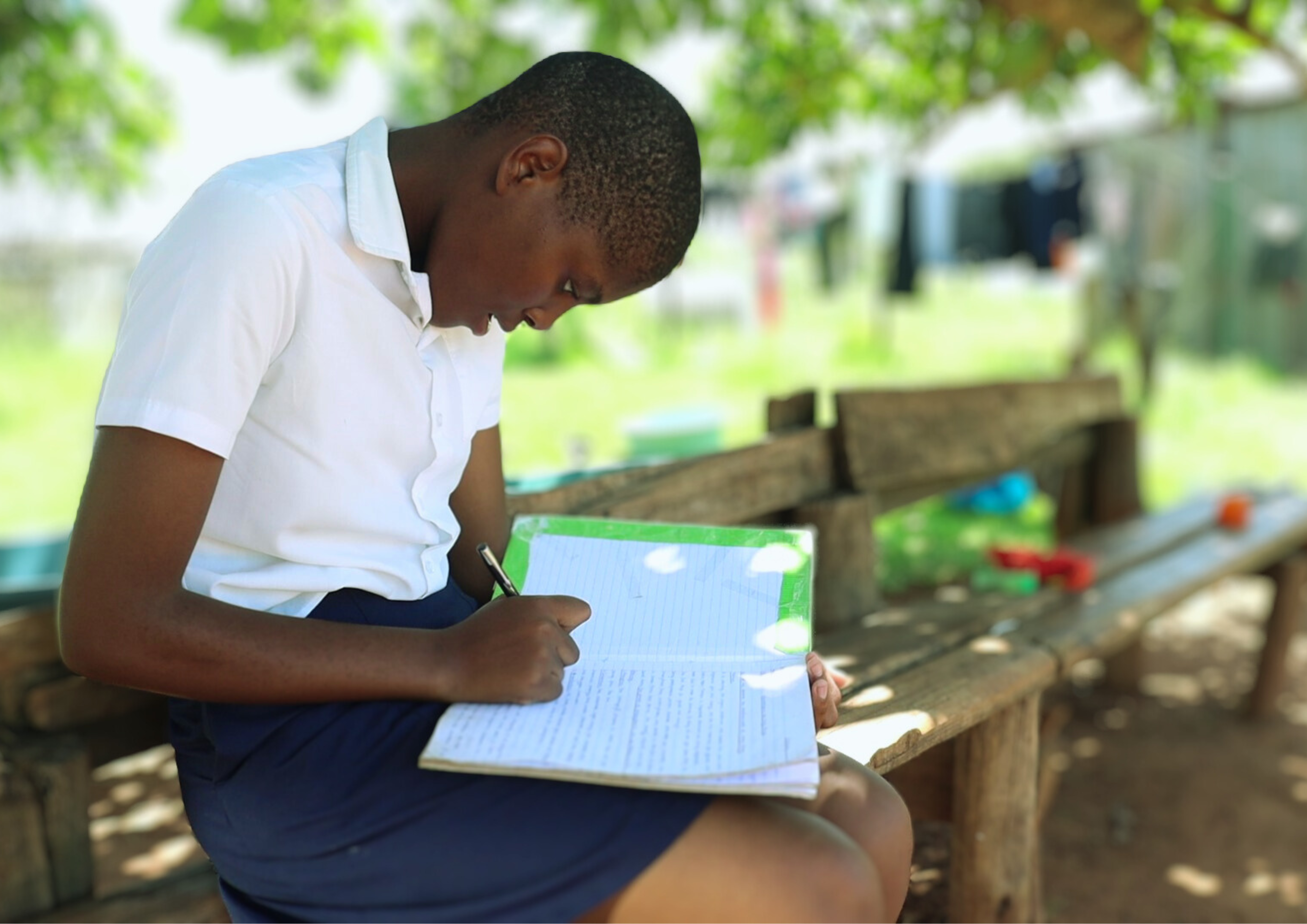 Nokukhanya doing her homework afterscool.