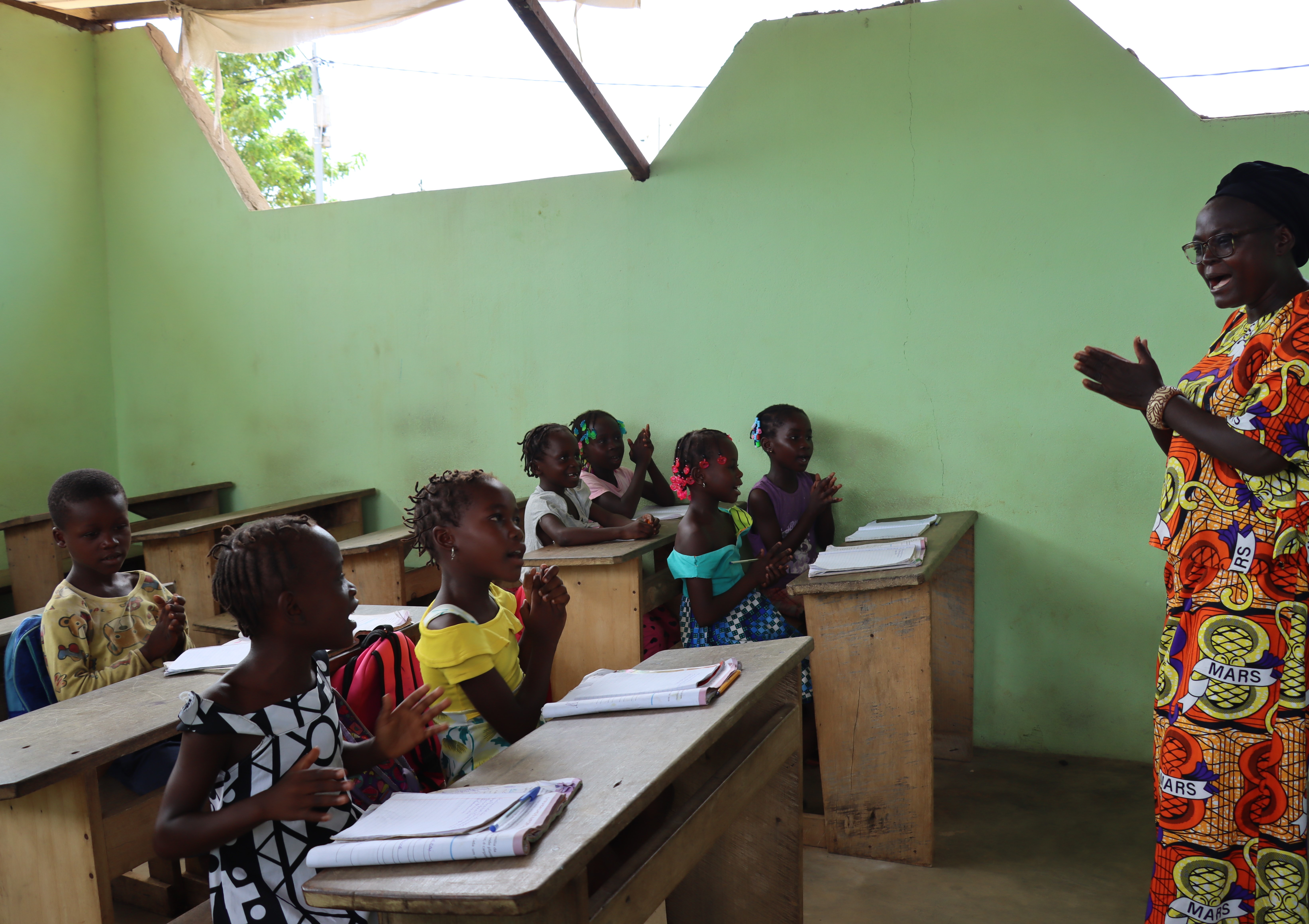 Juliana teaching the children with great joy