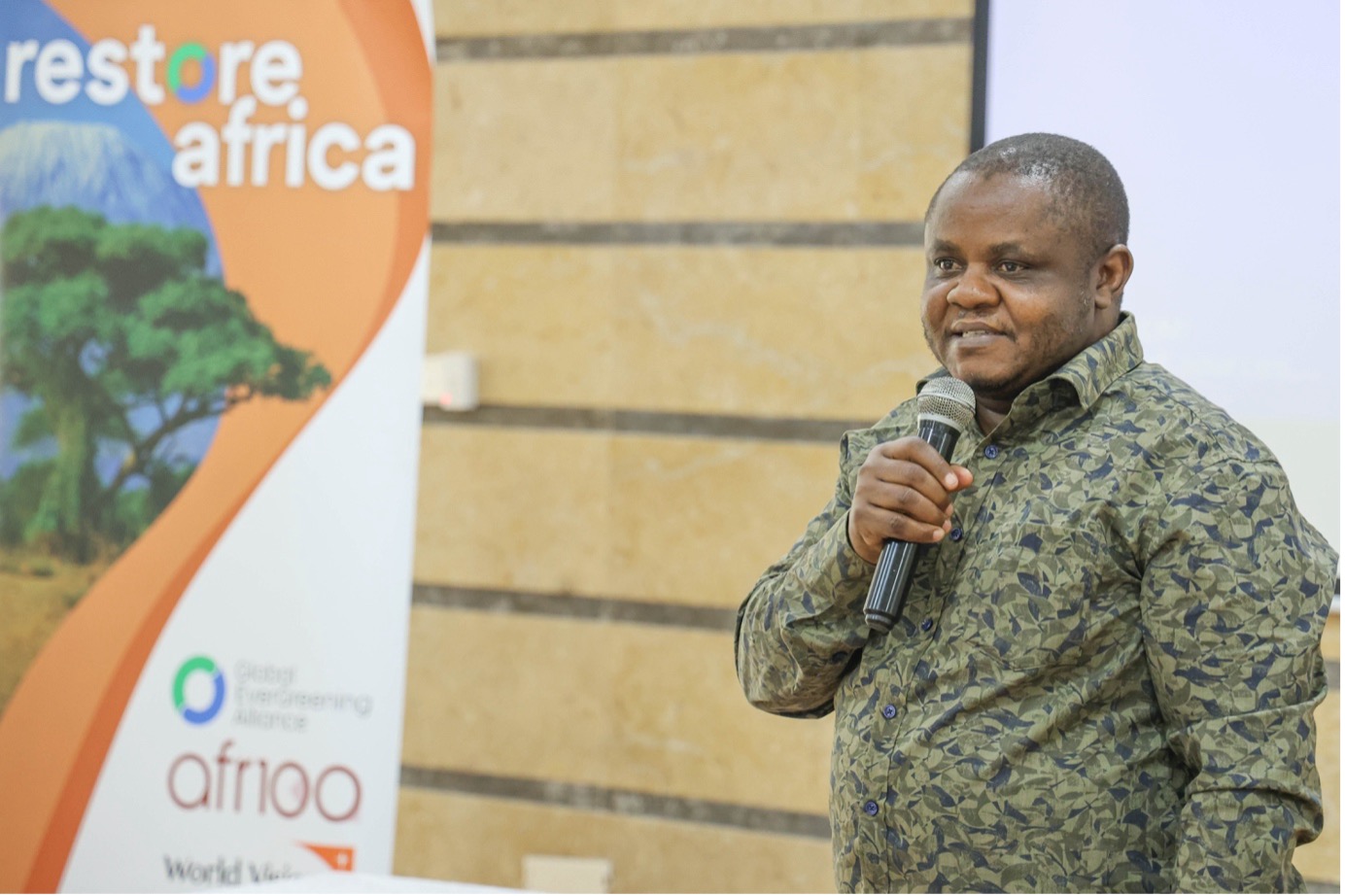 Amos Wekesa, Carbon Specialist at the Global EverGreening Alliance, delivering his remarks during the stakeholder feedback session for the Restore Africa Programme. © World Vision Photo/Felix Pilipili