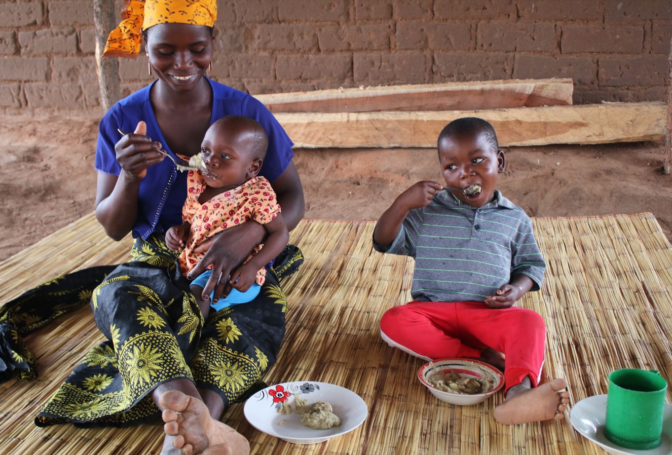 Juvencio eats nutritious food with his little sister