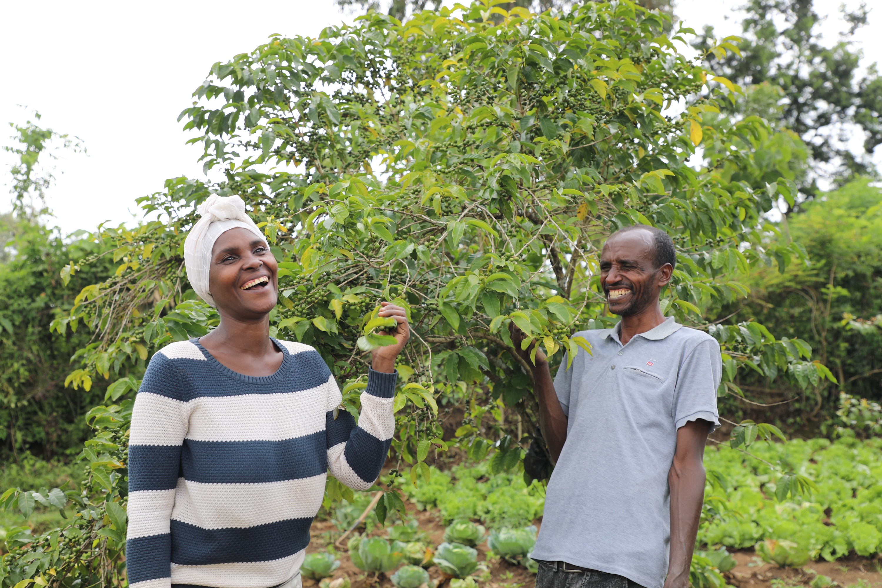 Kifle and Daniel smiling at their farm