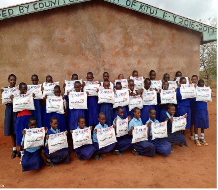 Girls from Kitui and Tana River Counties display dignity kits received from World Vision Kenya through support from USAID-Bureau for Humanitarian Affairs. Photo: File/World Vision Kenya 2024.