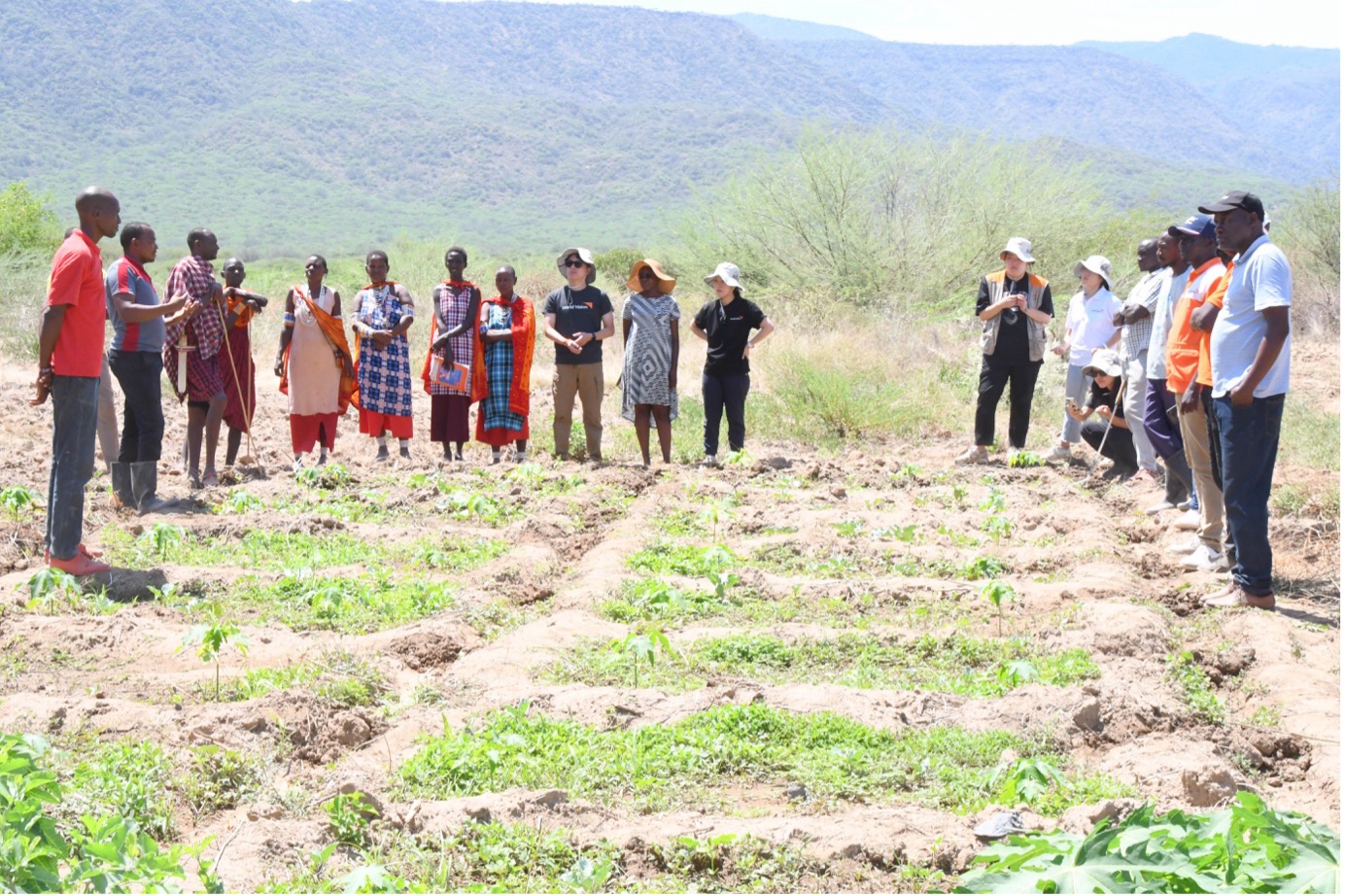 Members of the Osupuko Restoration Group welcome World Vision staff during a field monitoring visit in November 2024. © World Vision Photo/Felix Pilipili