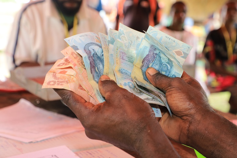 An example of a Savings Group in Sotebu village, Middle Ramu District, Madang Province – Papua New Guinea. Raymond and his family are also part of a Savings Group such as these and they have used it to save money for their children’s school fees. Picture: Steven Doe.