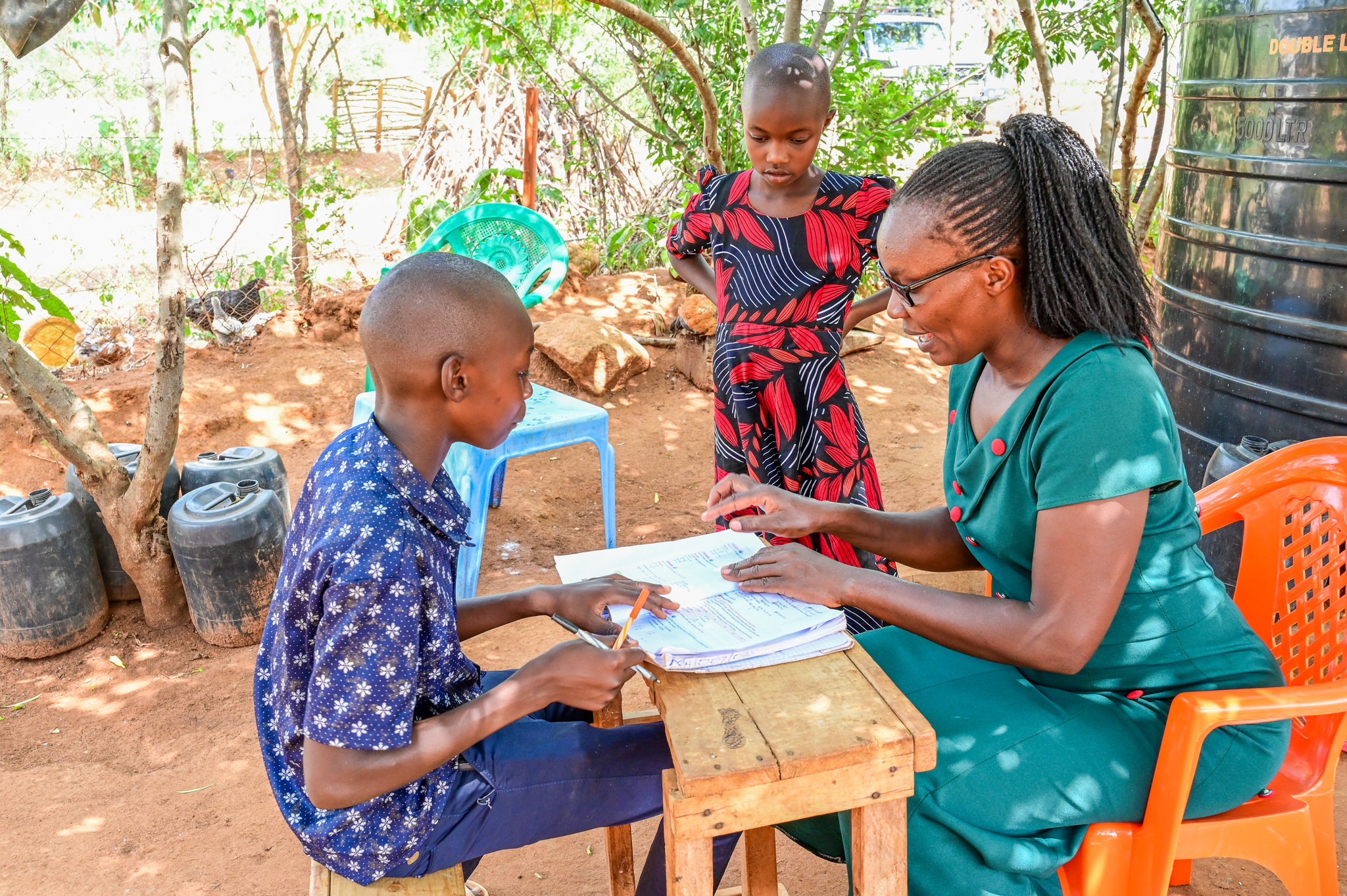 Mercy finds fulfillment in being available for her children, especially to support them with schoolwork. ©World Vision Photo/ Hellen Owuor