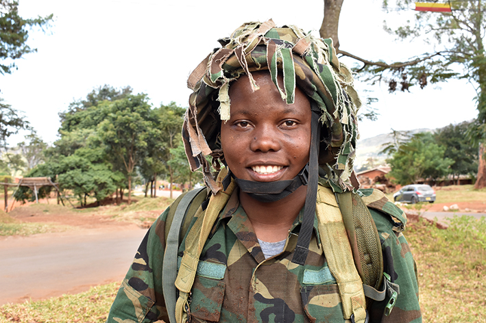 Tiyamike a Former Registered Child in her Defense force uniform.