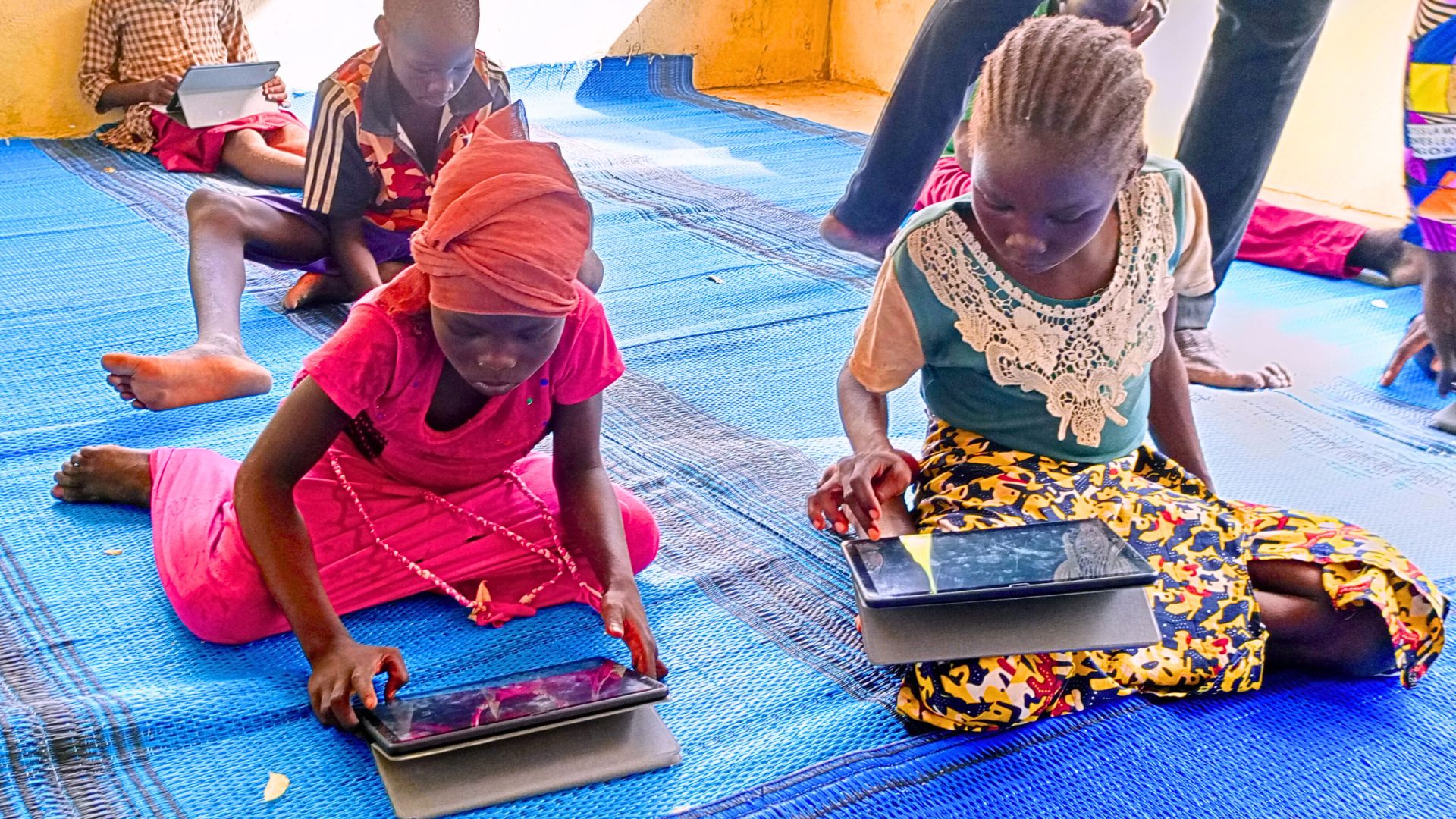 Little girls using tablets