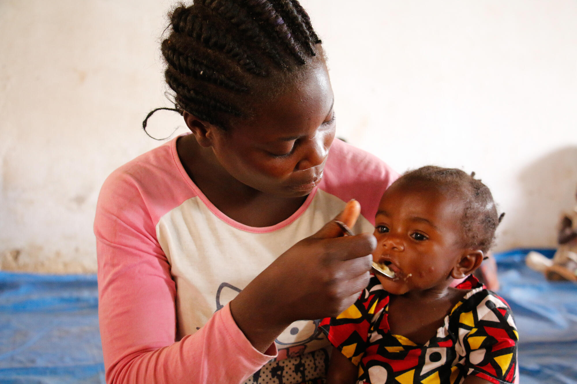 mother feeding child