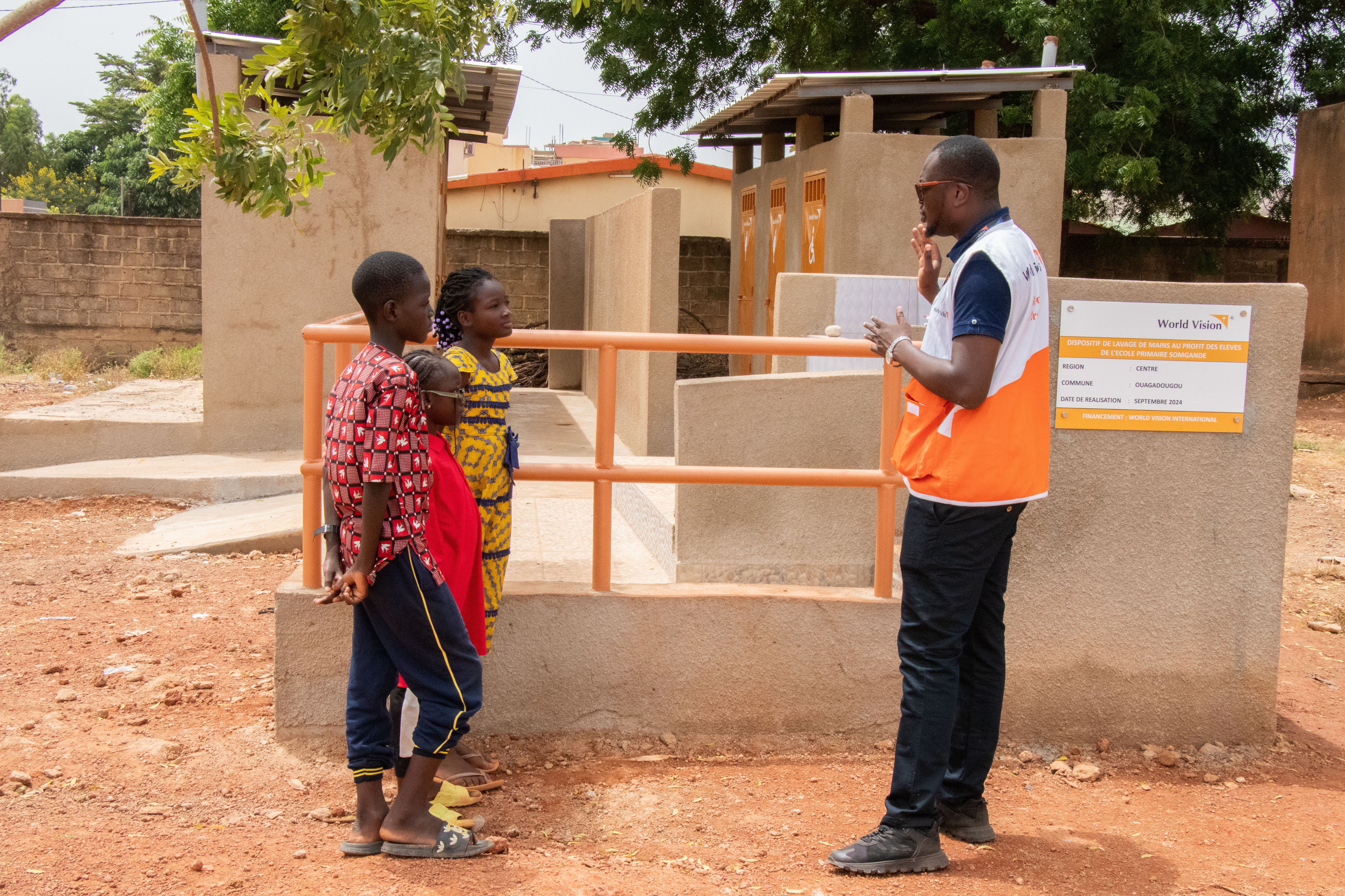 WASH officer sensitizes pupils on the use of the hand-washing device