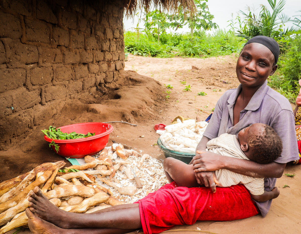 Above:  A smiling mother and child are just two of the many who received assistance through a World Vision Taiwan-funded food security and climate intelligence project in Mulwani, Democratic Republic of Congo (DRC) that was designed to increase agricultural production and teach climate-smart practices. / © World Vision 