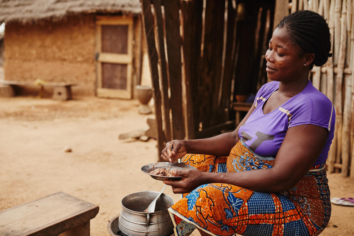 A Ghanian woman cooking