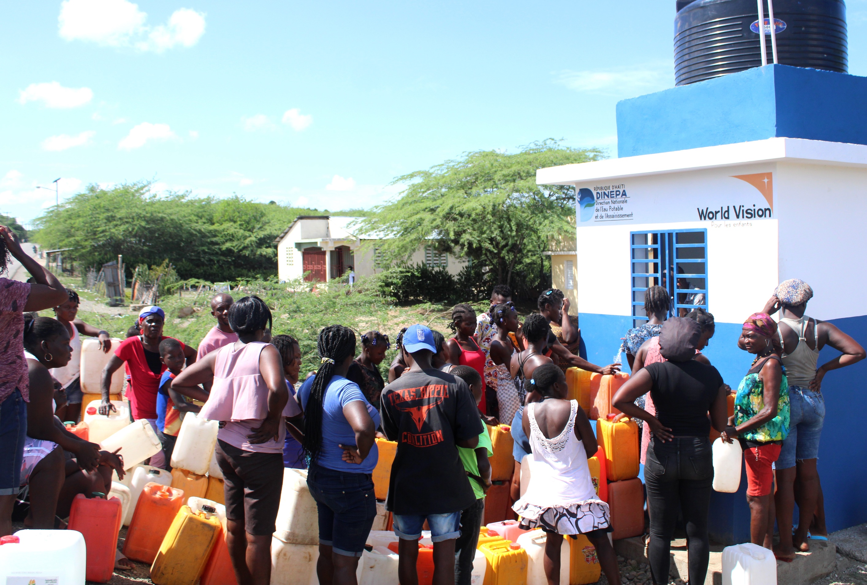 People gather at the water point