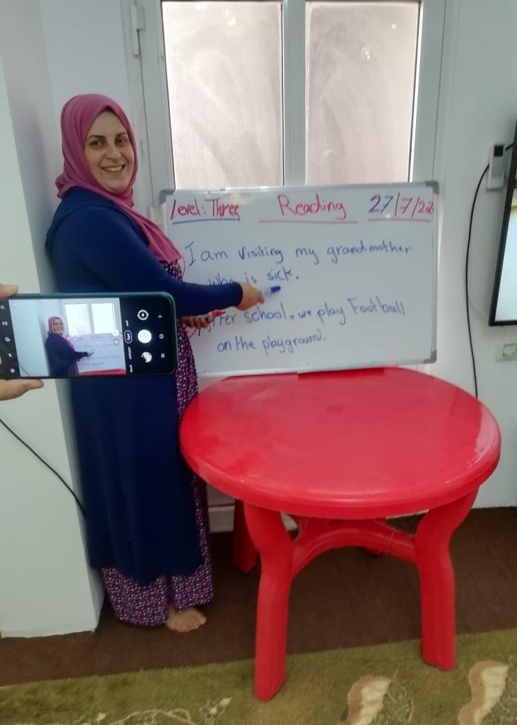 Nashed teaches english via cell phone in Jordan to Syrian refugee children