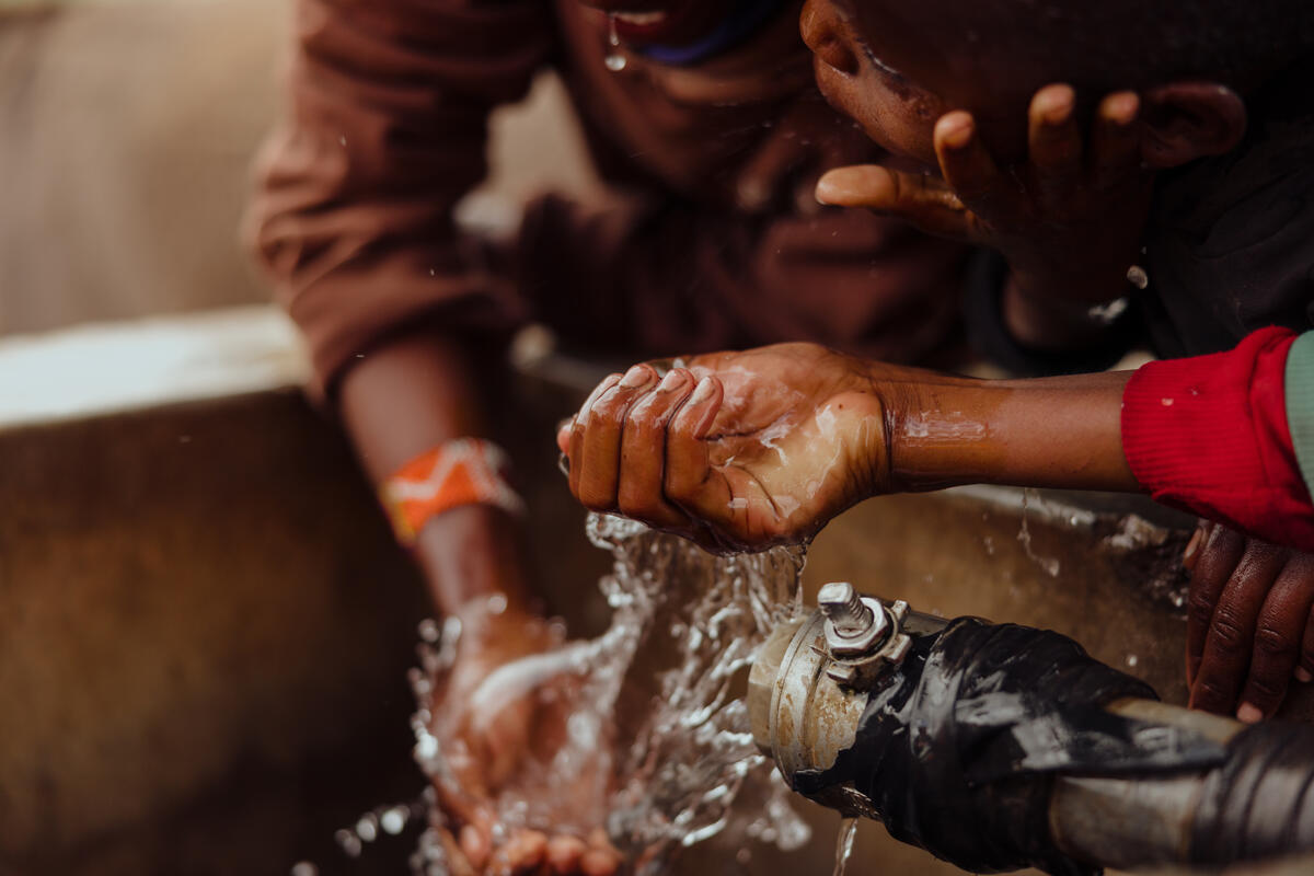 Children playing with clean water