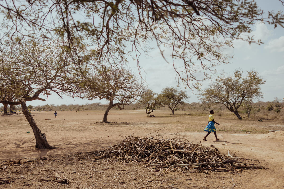 Faith walking in an area suffering from drought