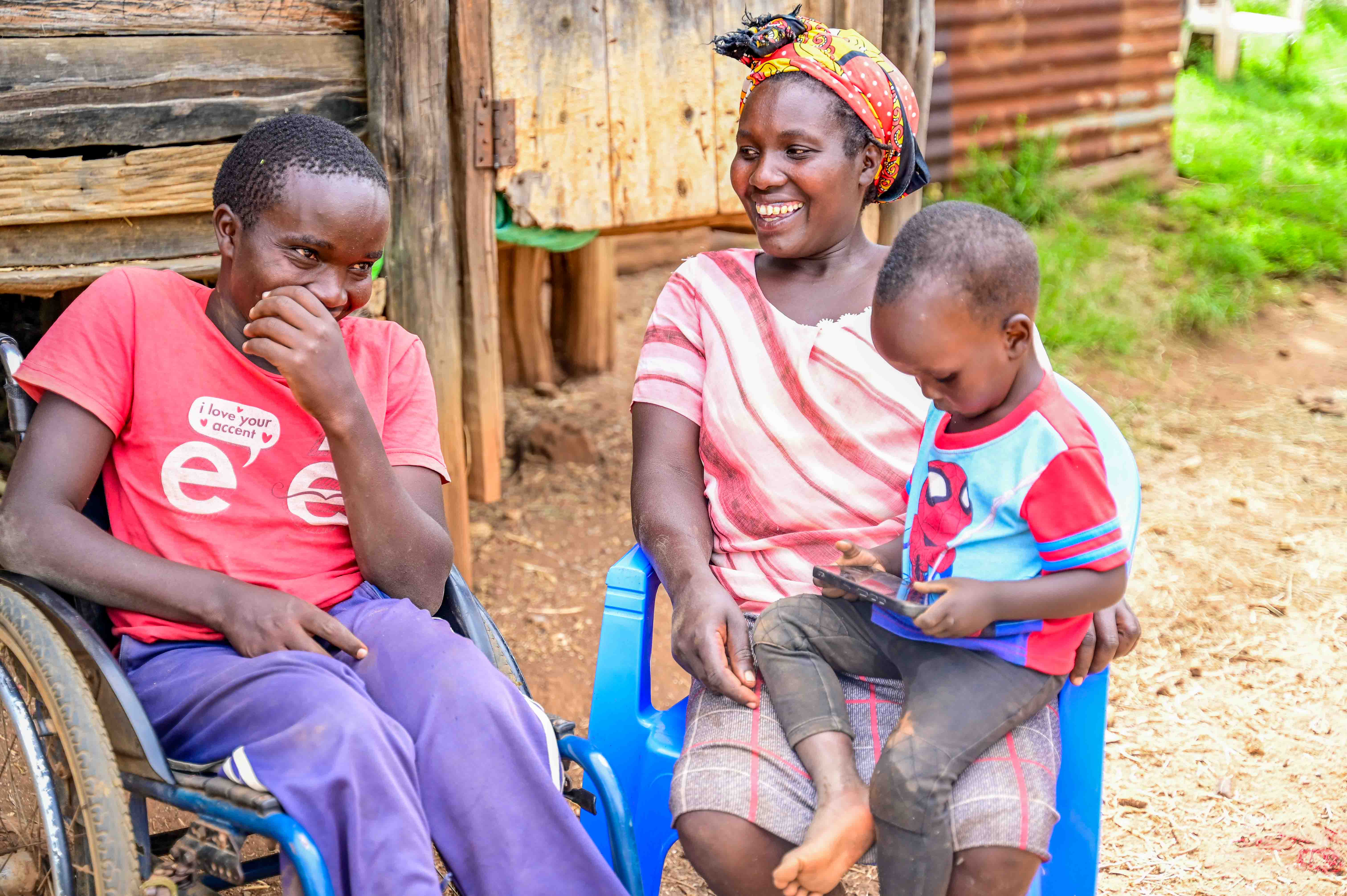 Sally can now spend time with her children since she has firewood and pasture within her homestead. © World Vision Photo/Hellen Owuor.