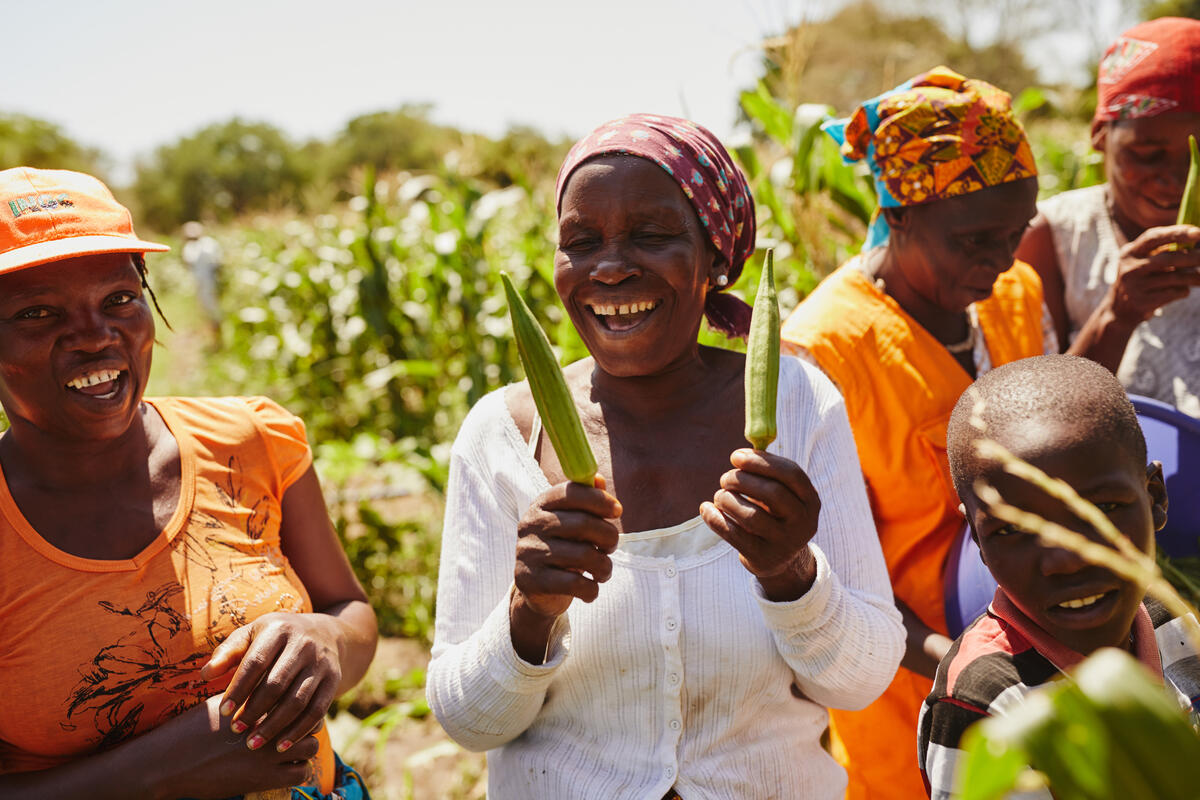 A woman showing her crops