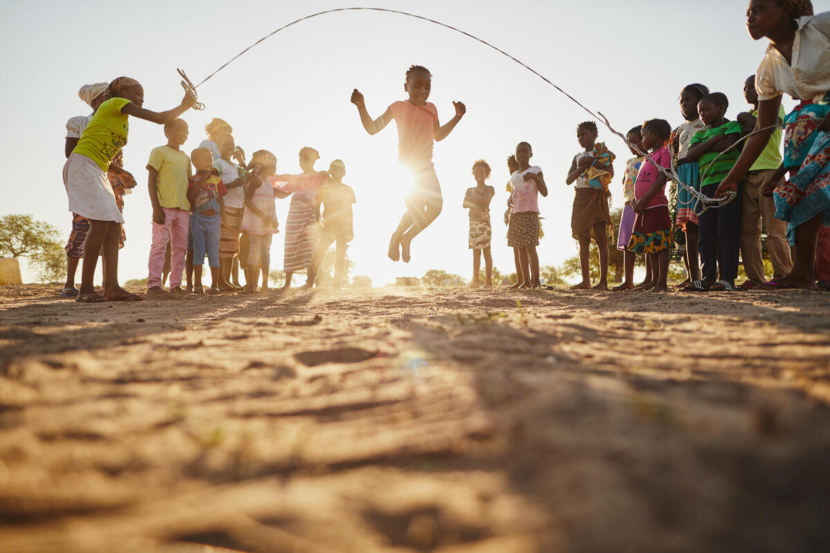 Group of children playing rope