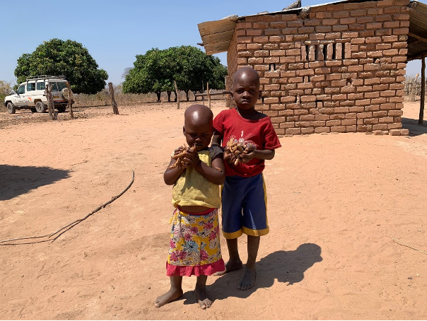 Mambowatema's children with wild fruits they gathered