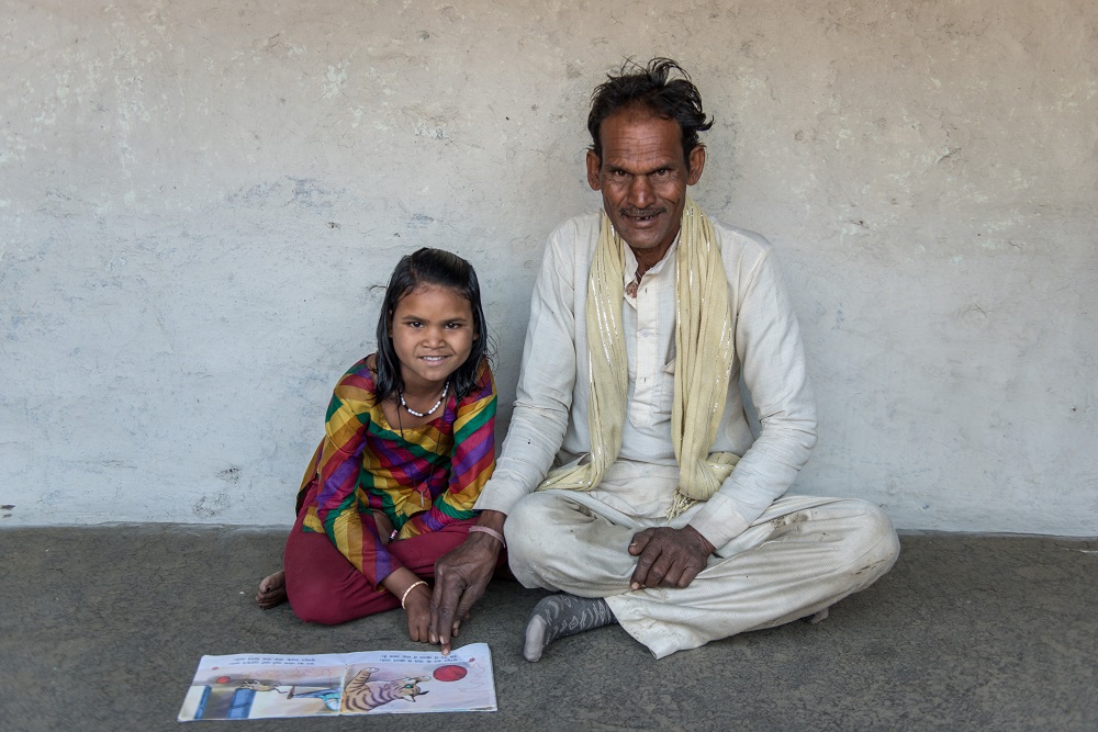 Sakhi and her father read together