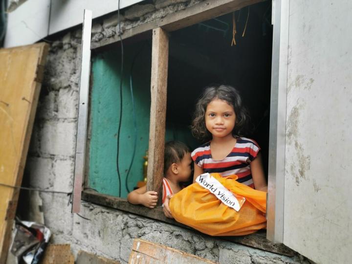 COVID-19 Emergency Response, girl with donations