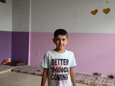 Child in Lebanon with hopeful t-shirt 