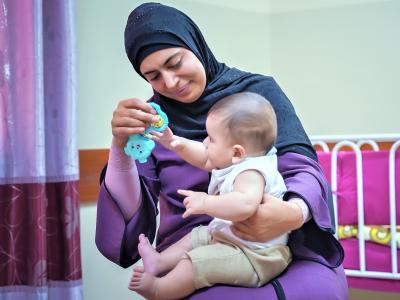 Mother supported by go baby go in Nablus, West Bank