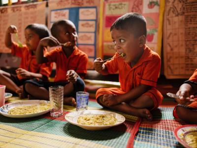 Sponsored children from Bangladesh having a school meal.