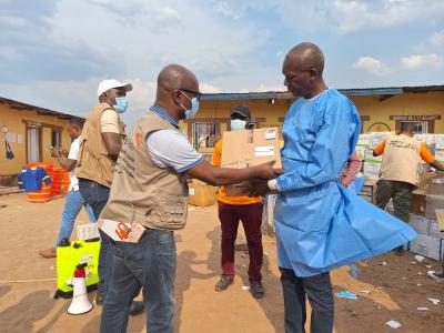 Samuel Djesse, WV DRC South Zone Director handling the donation to the Head of the health zone