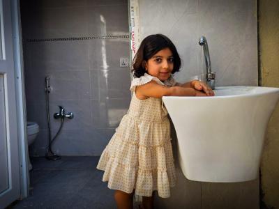 Rayan uses her new handwashing facilties